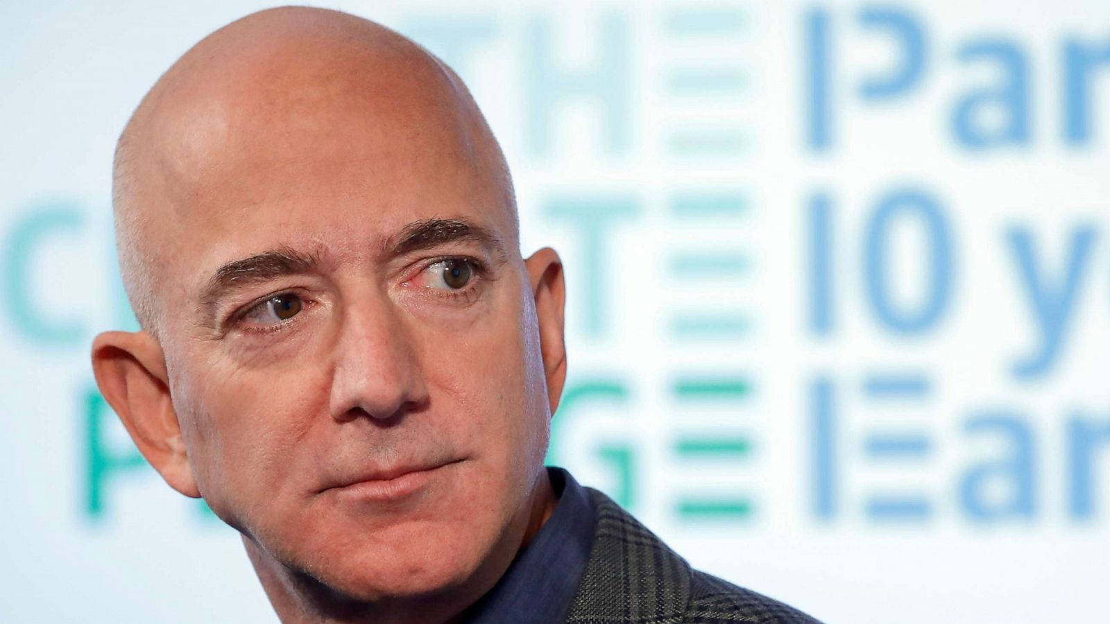 Jeff Bezos Against Text Background Wallpaper