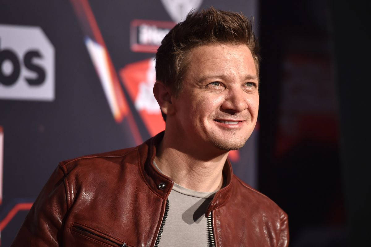 Jeremy Renner Smiling On Spotlight Wallpaper