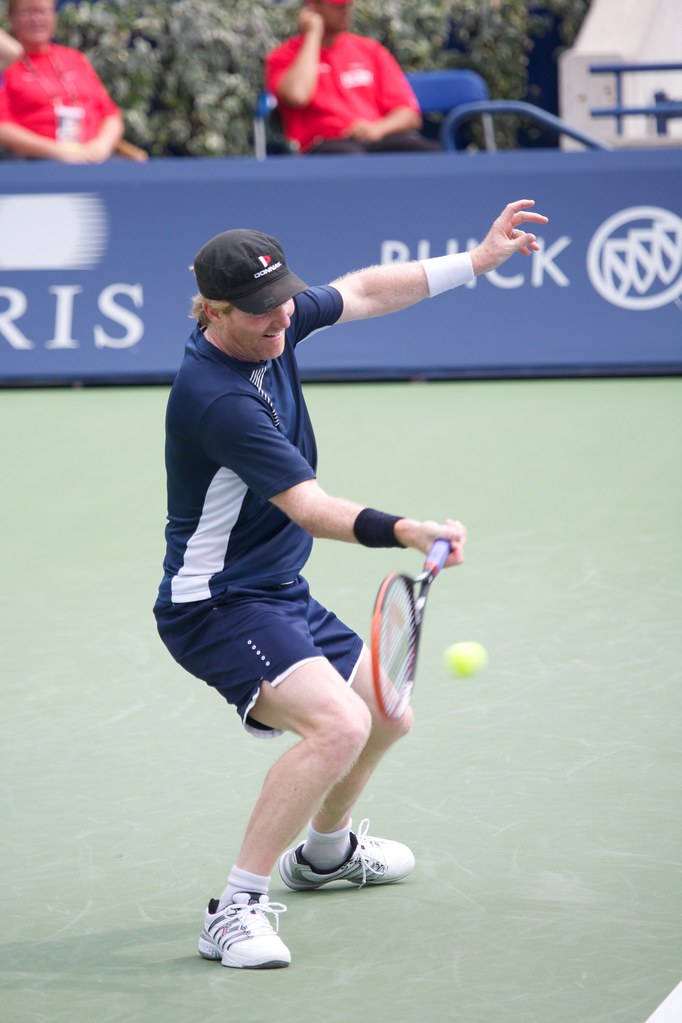 Jim Courier Displaying Expert Tennis Skills Wallpaper