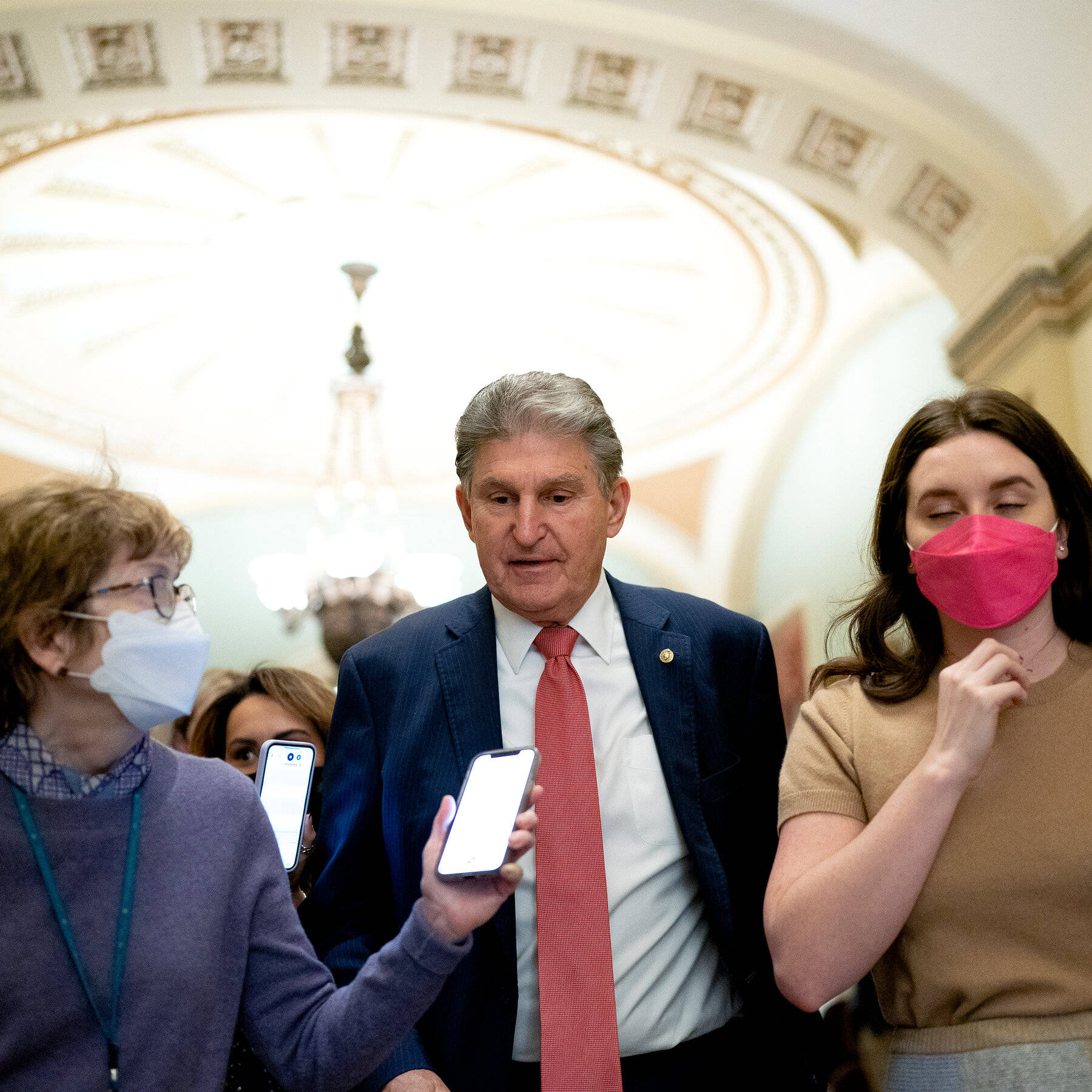 Joe Manchin Walking With The Reporters Wallpaper