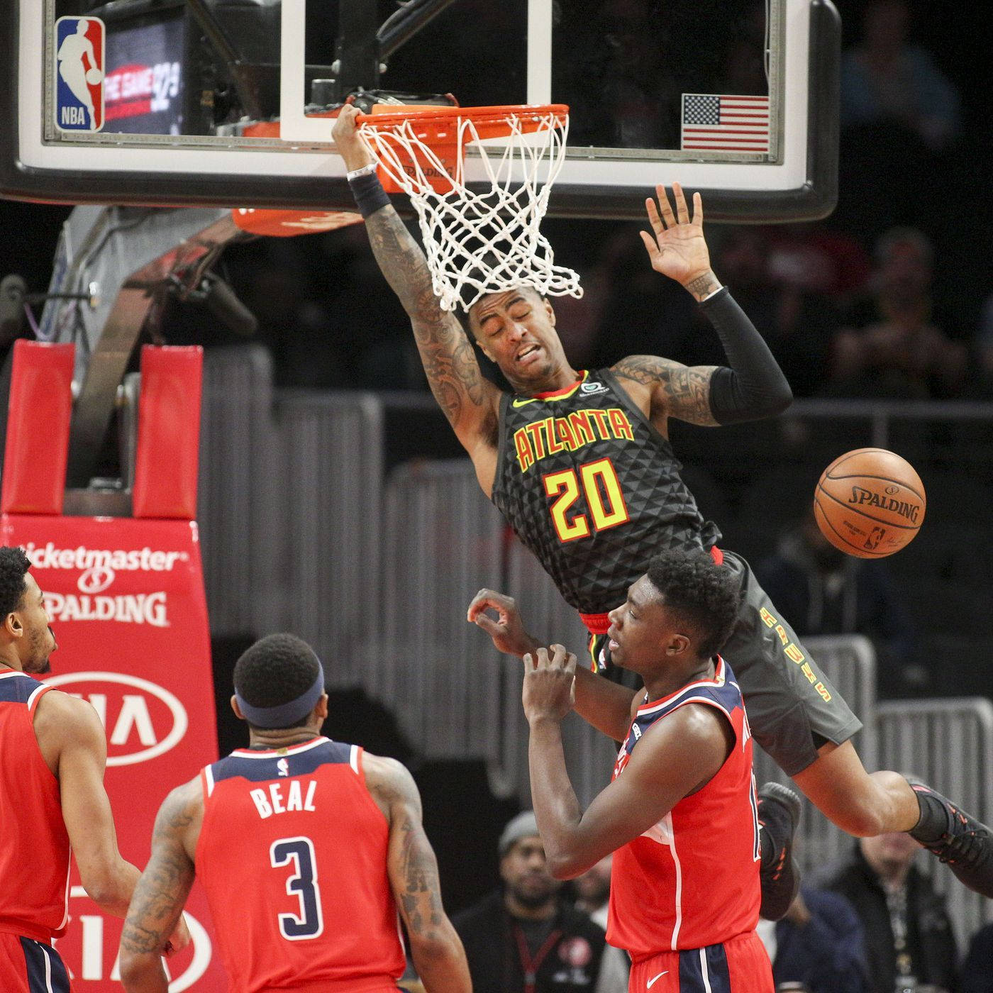 John Collins, Nba Star, Showcasing His Dunking Skills In The Ring Wallpaper