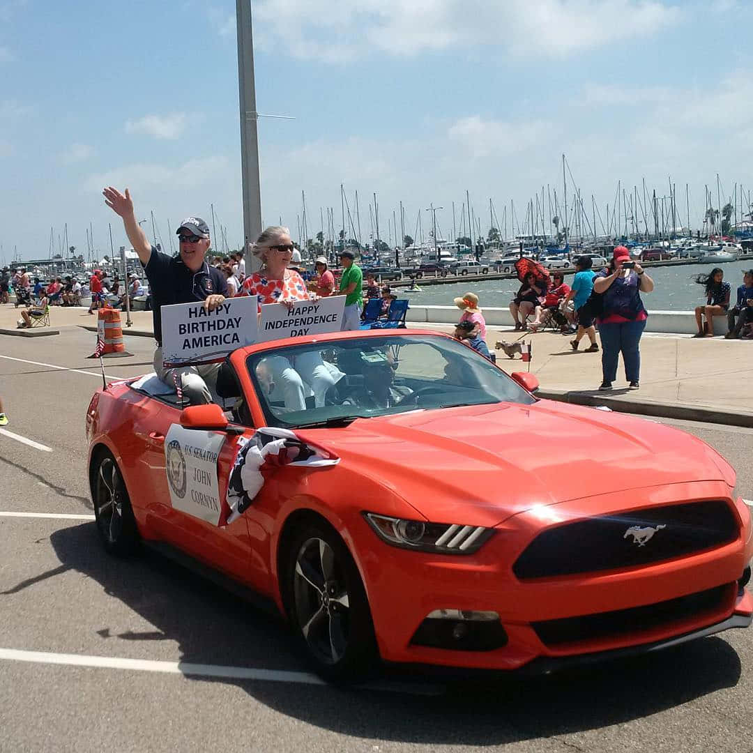 John Cornyn Riding On A Car Wallpaper