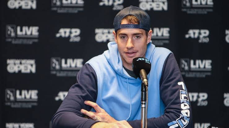 John Isner During A Press Conference Wallpaper