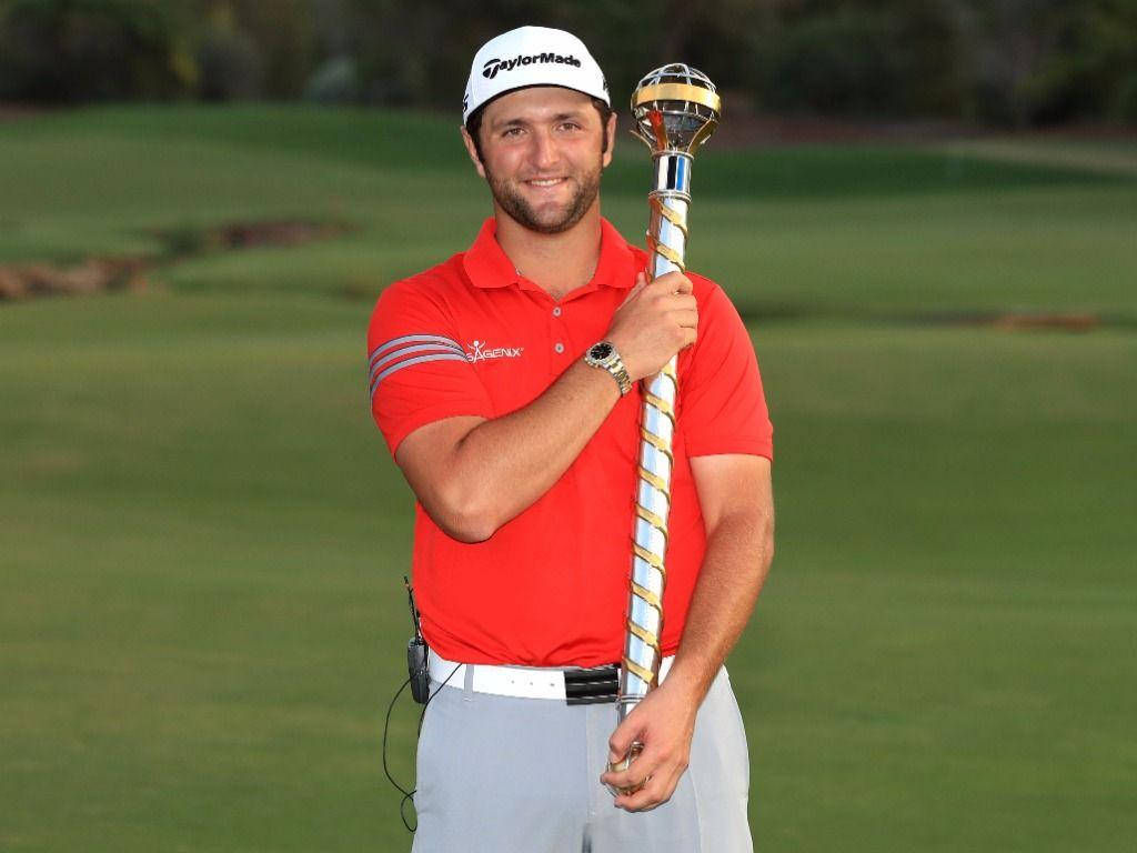 Jon Rahm With A Gold Baton Wallpaper