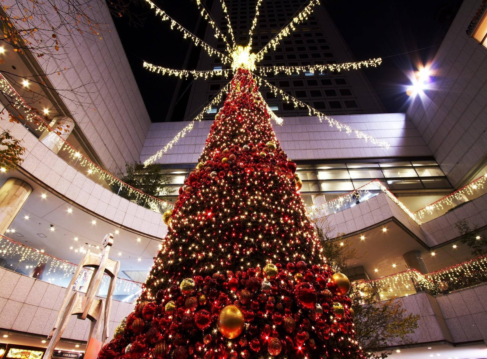 Joy Of Shopping – A Red Christmas Tree At A Mall Wallpaper