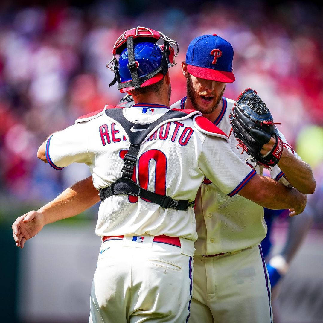 Jt Realmuto And Teammate Hug Wallpaper