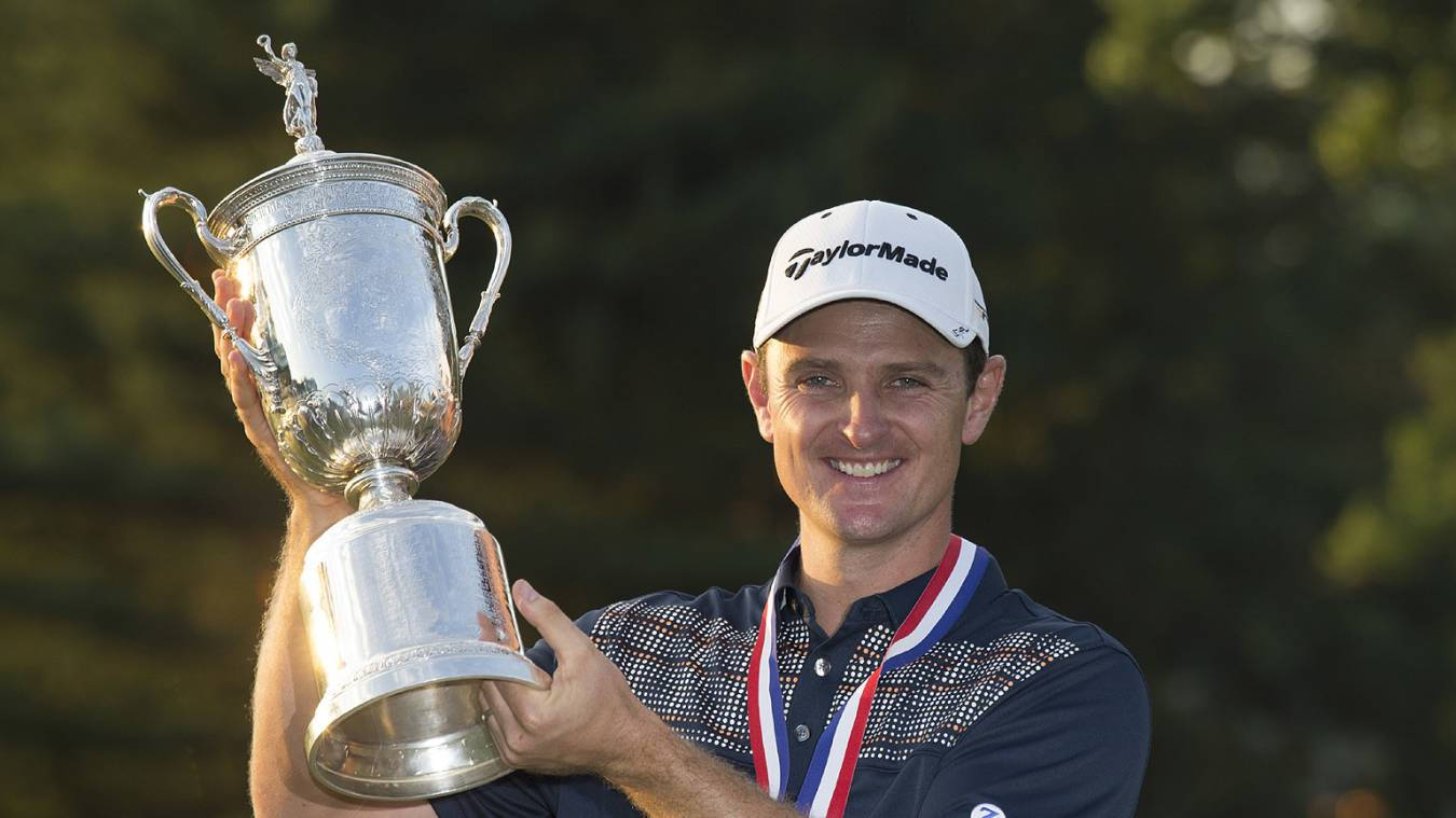 Justin Rose Smiling While Raising A Trophy Wallpaper