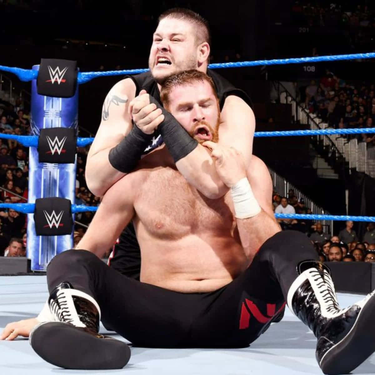 Kevin Owens Sami Zayn Wwe Match Wallpaper