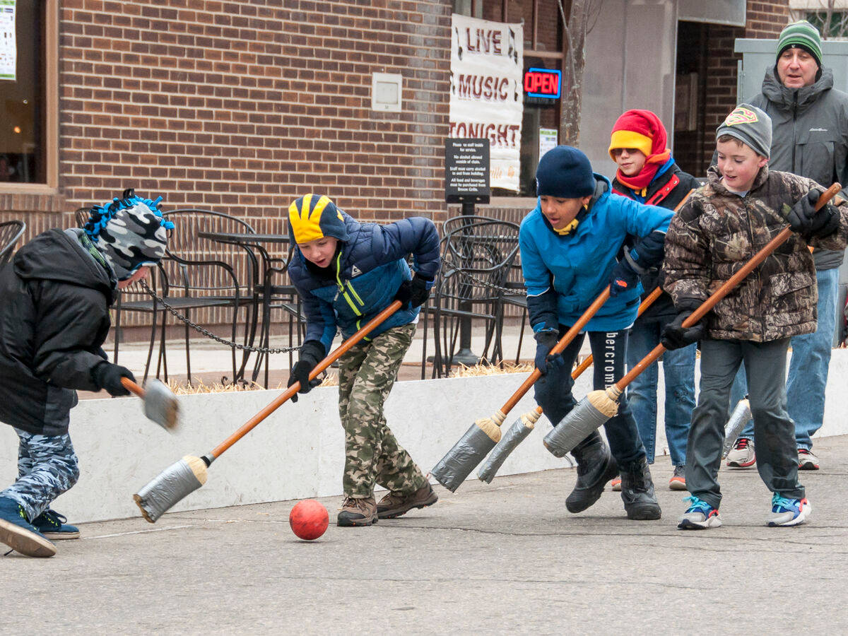 Kids Playing Broomball Wallpaper