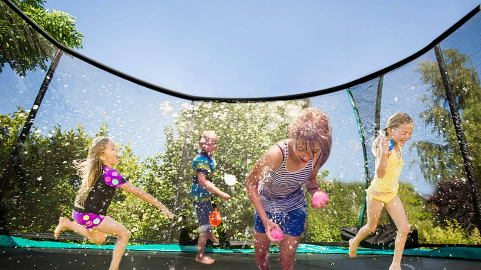 Kids Playing Inside A Trampoline Wallpaper