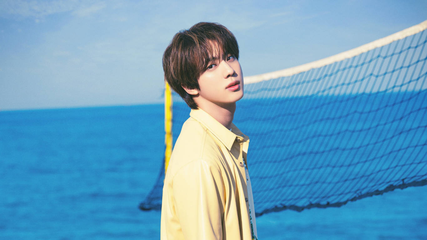 Kim Seok Jin Enjoying A Day At The Beach Wallpaper