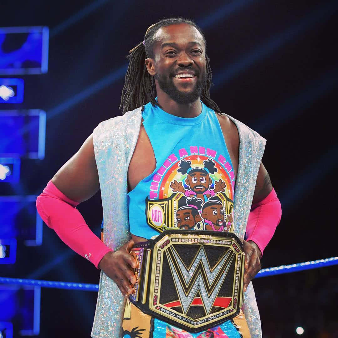 Kofi Kingston In A Multi-colored Attire With A Wwe Belt Wallpaper