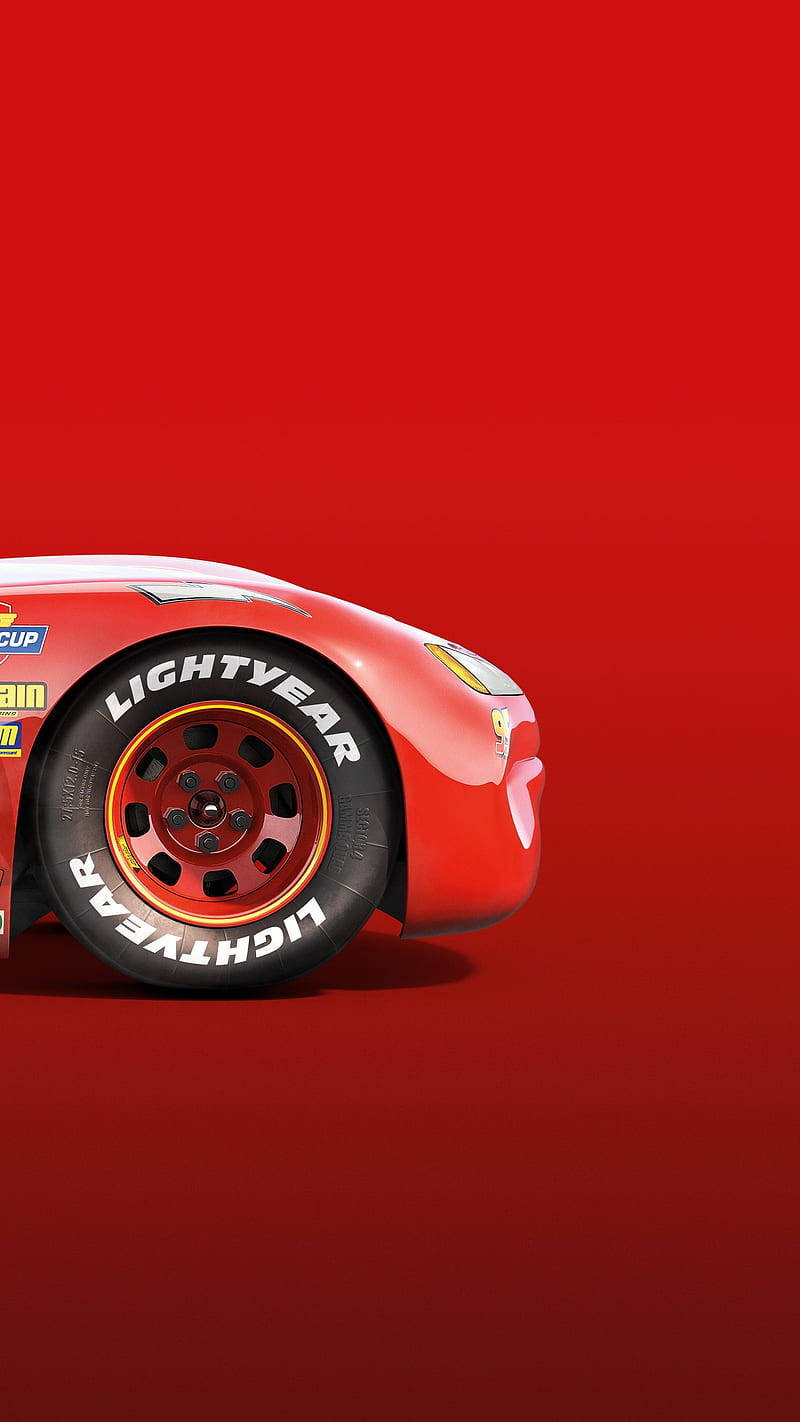 Lightning Mcqueen Racing On The Track Wallpaper