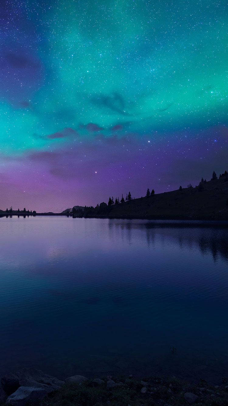 Lights Of The Sky: A Night Sky Glowing With The Mysterious Aurora Borealis. Wallpaper