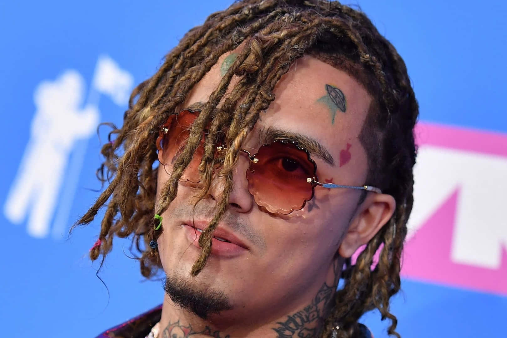 Lil Pump Rocking An Orange Hoodie Wallpaper