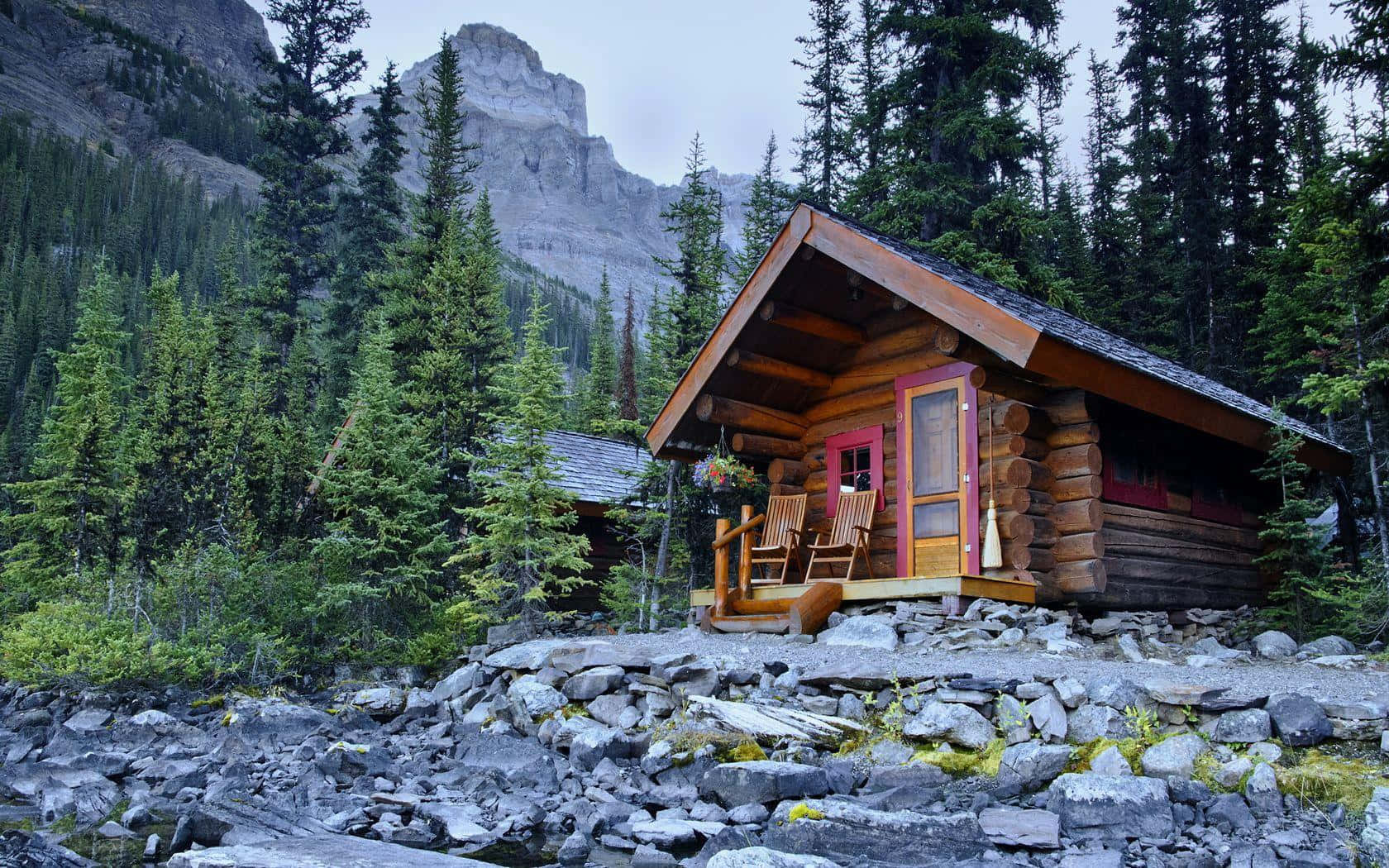 Log Cabin Placed On Rocks Wallpaper