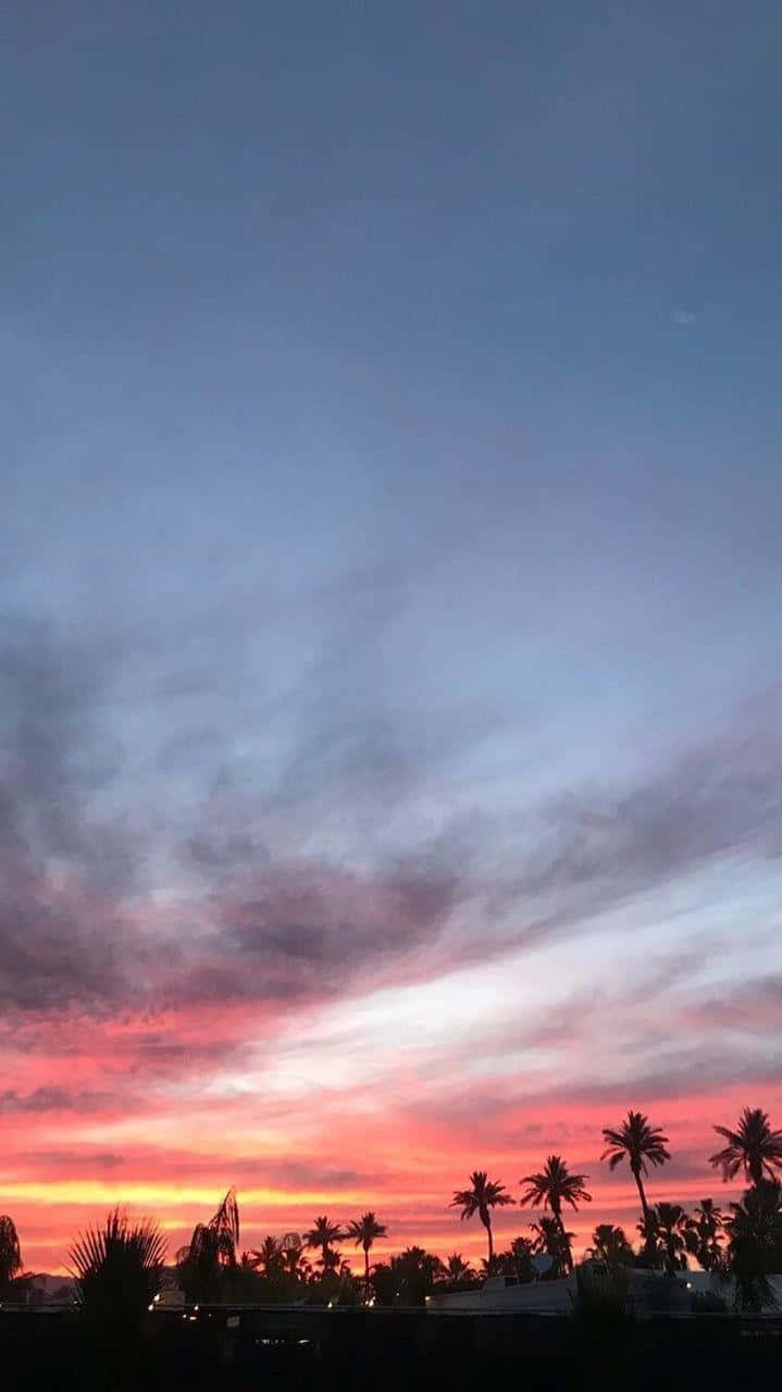 Look Up And Be Taken Away To Another World With The Beautiful Blue Sky. Wallpaper