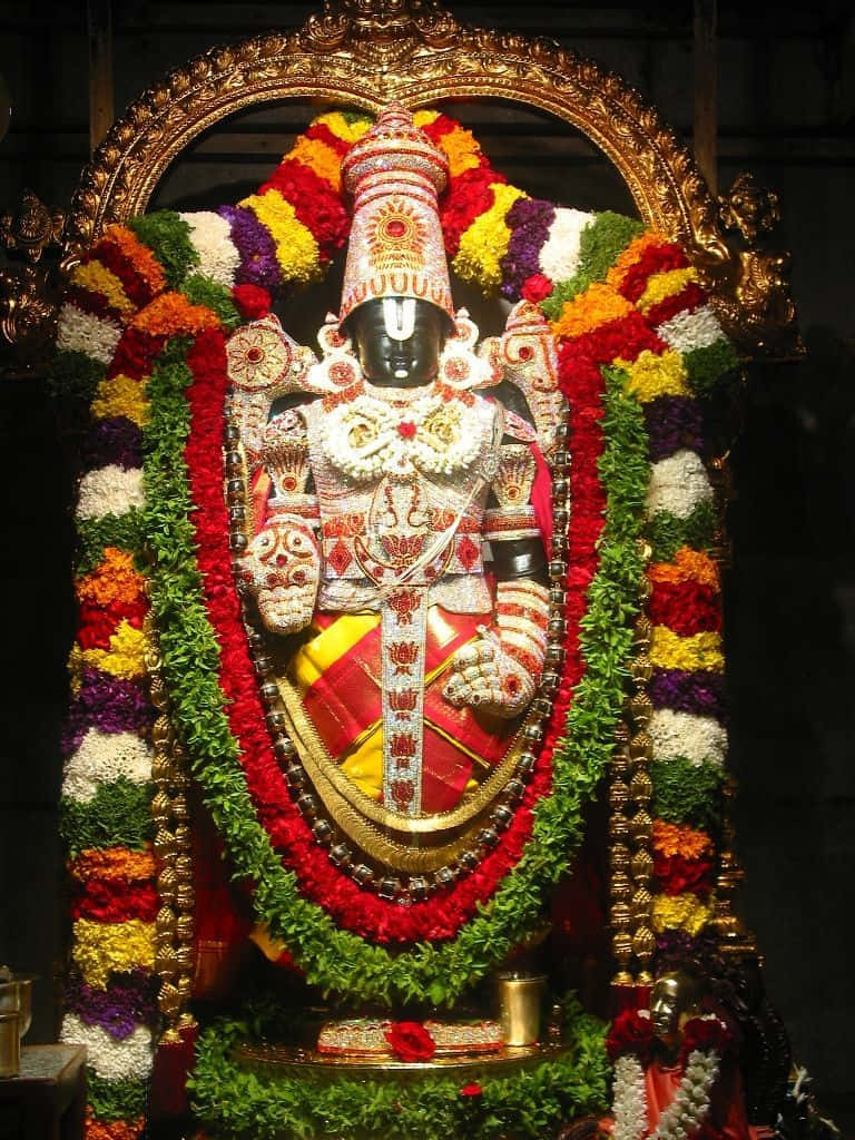 Lord Balaji Adornedin Flowersand Jewelry Wallpaper