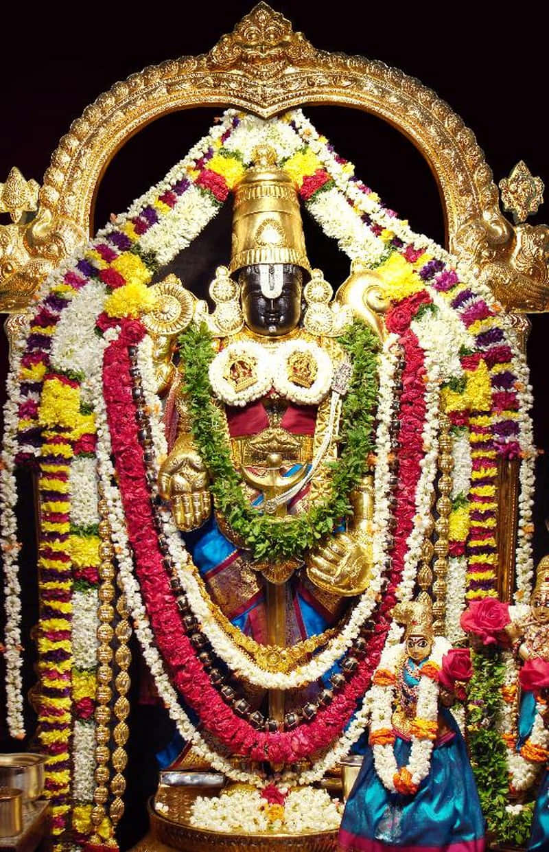 Lord Balaji Adornedin Flowersand Jewelry Wallpaper