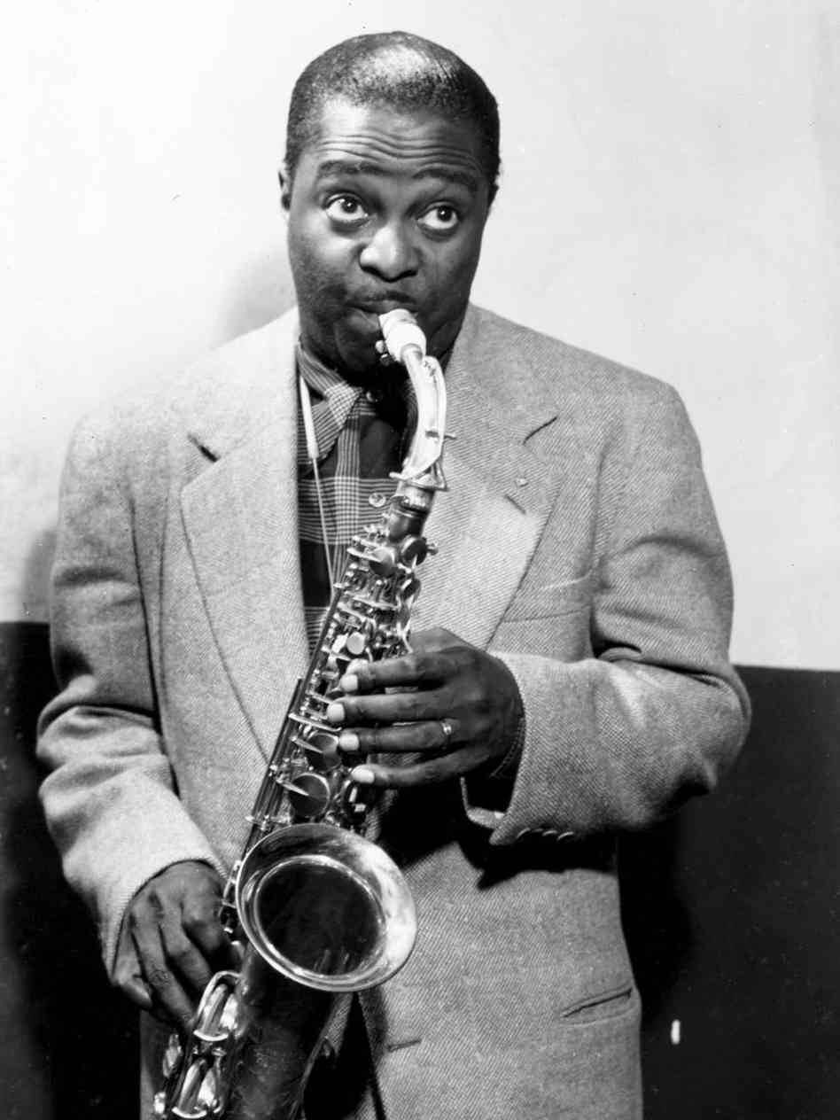 Louis Jordan Playing His Saxophone In 1950 Wallpaper