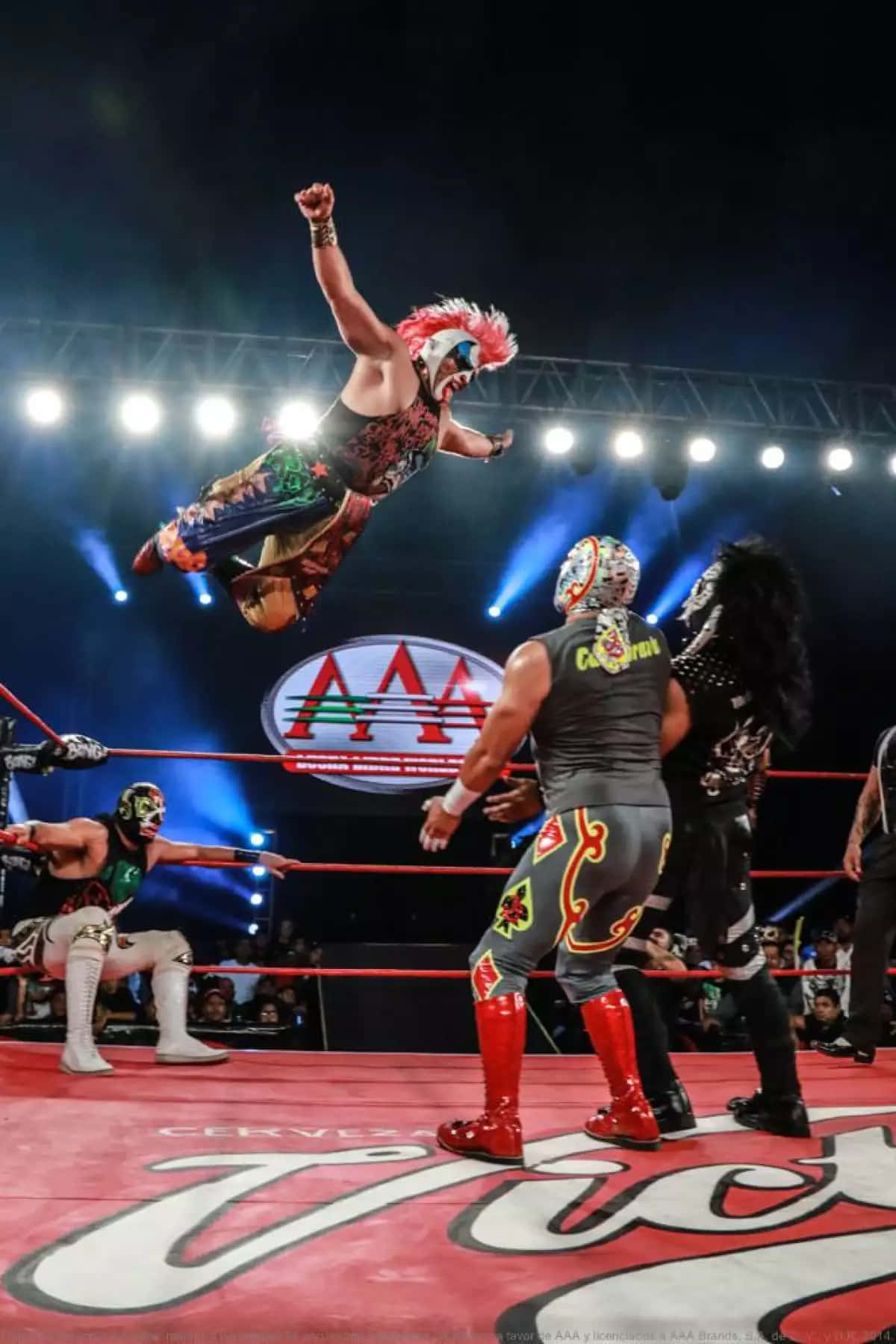 Luchador Mid Air Attack Wrestling Match Wallpaper