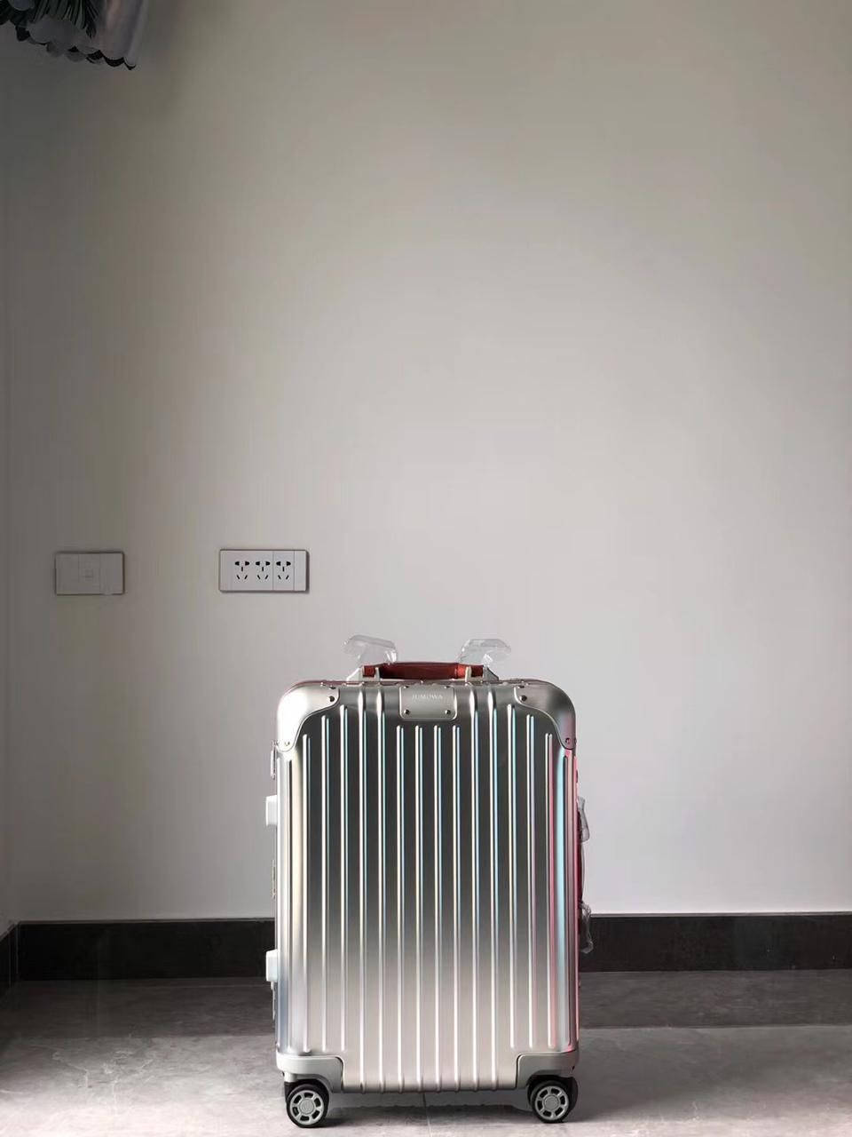 Luxurious Travel With Rimowa Original Cabin S Suitcase Wallpaper