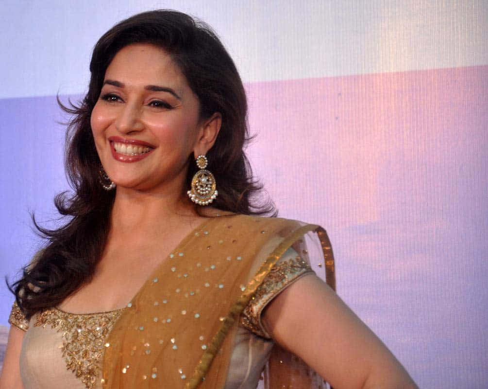 Madhuri Dixit Smiling Elegantlyat Event Wallpaper