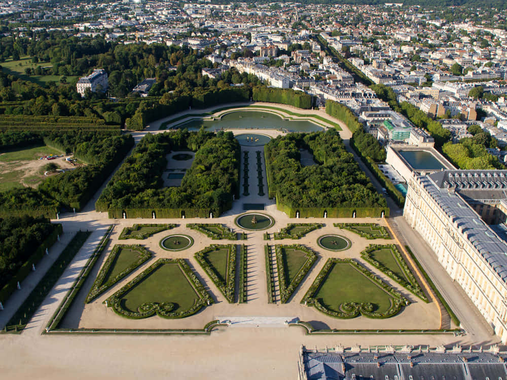 Majestic North And South Parterres Of The Palace Of Versailles Wallpaper