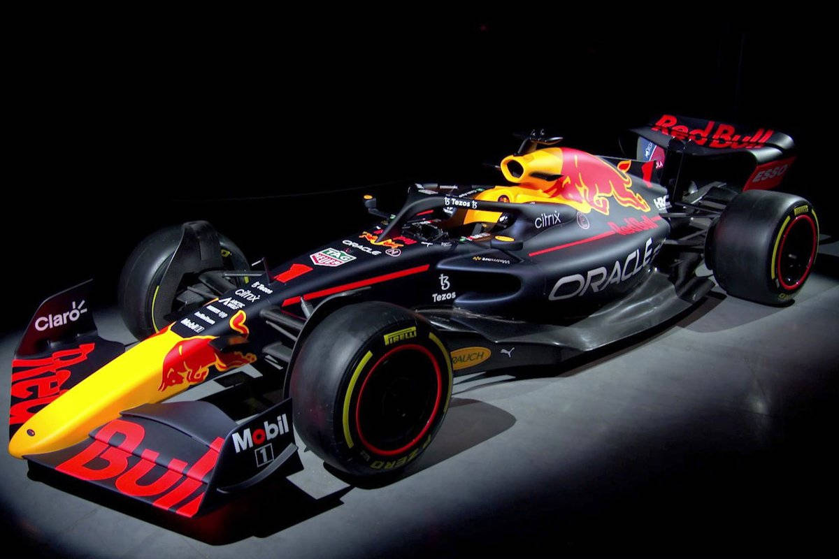 Majestic Red Bull Racing Car In A Mysterious Dark Room Wallpaper