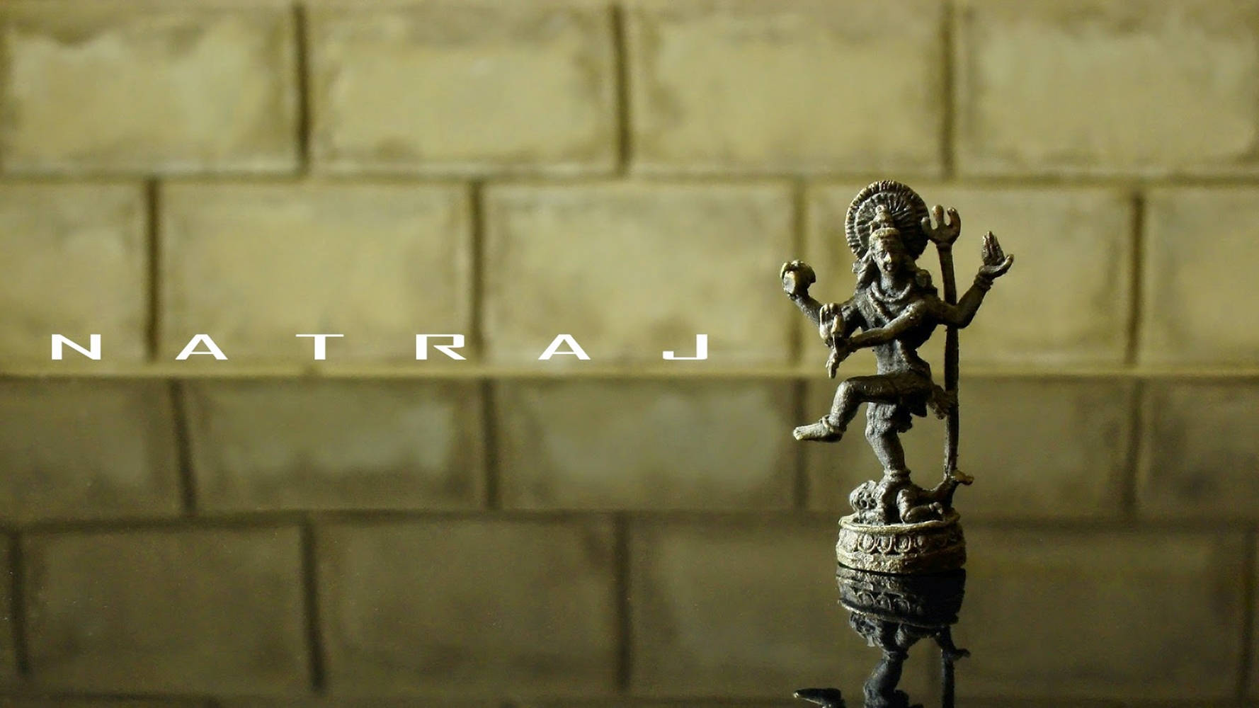 Majestic Stone Figurine Of Nataraja Wallpaper