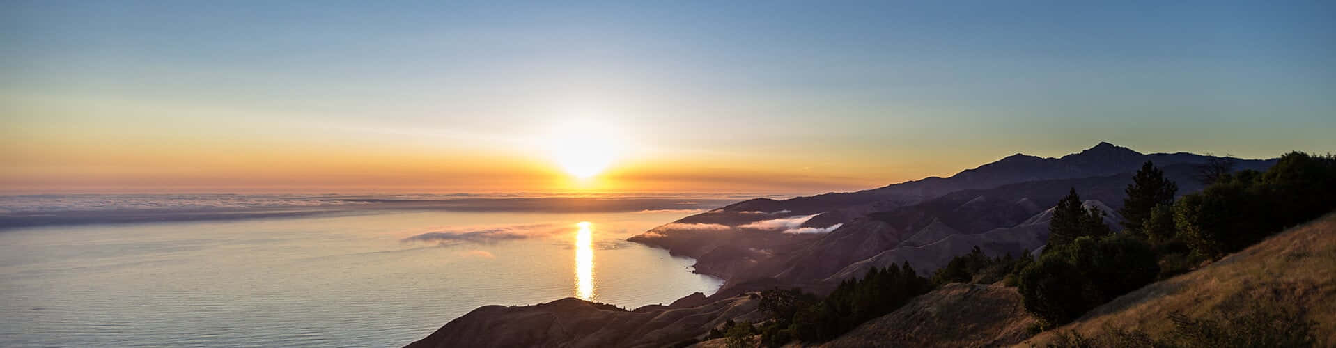 Malibu Beach At Dawn - A Picturesque Sunrise Wallpaper