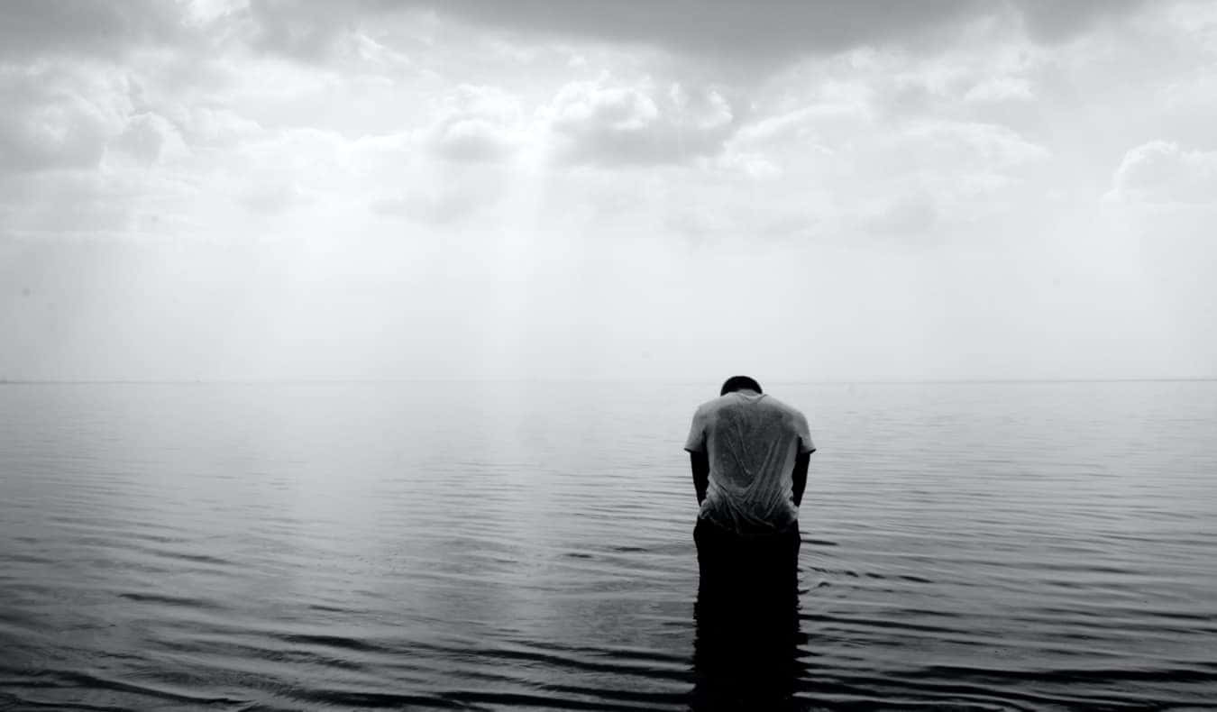 Man Overwhelmed With Sadness Wallpaper