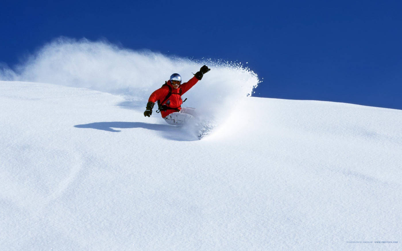 Man With Snowboard With One Arm Raised Wallpaper