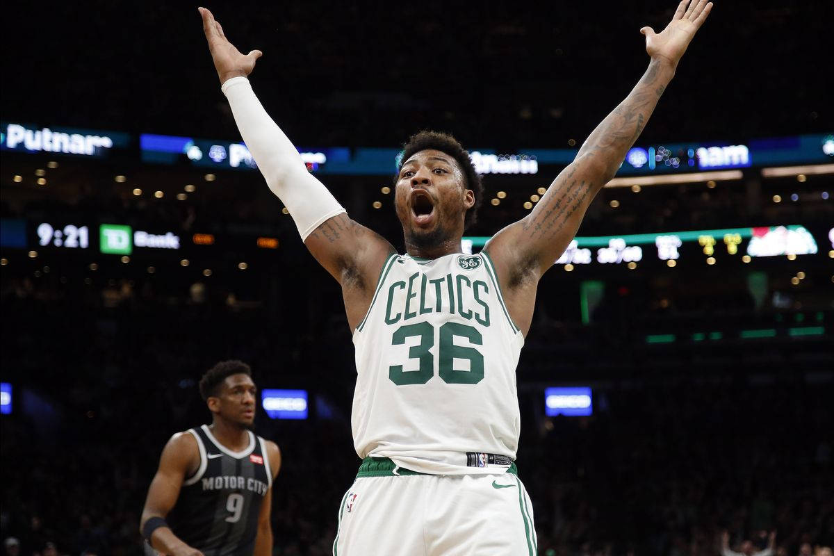 Marcus Smart Roars During Intense Game Wallpaper