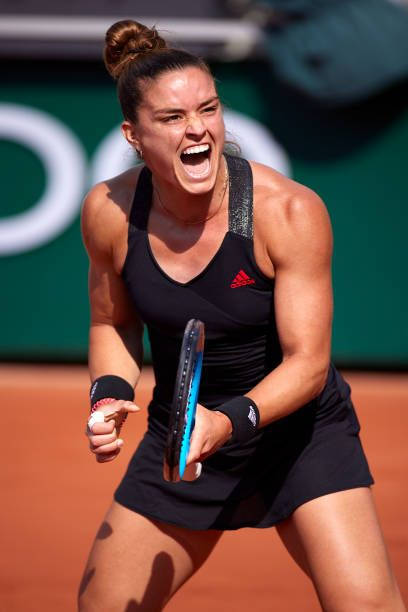 Maria Sakkari Exhibiting Her Strong Forehand Stroke On The Tennis Court. Wallpaper