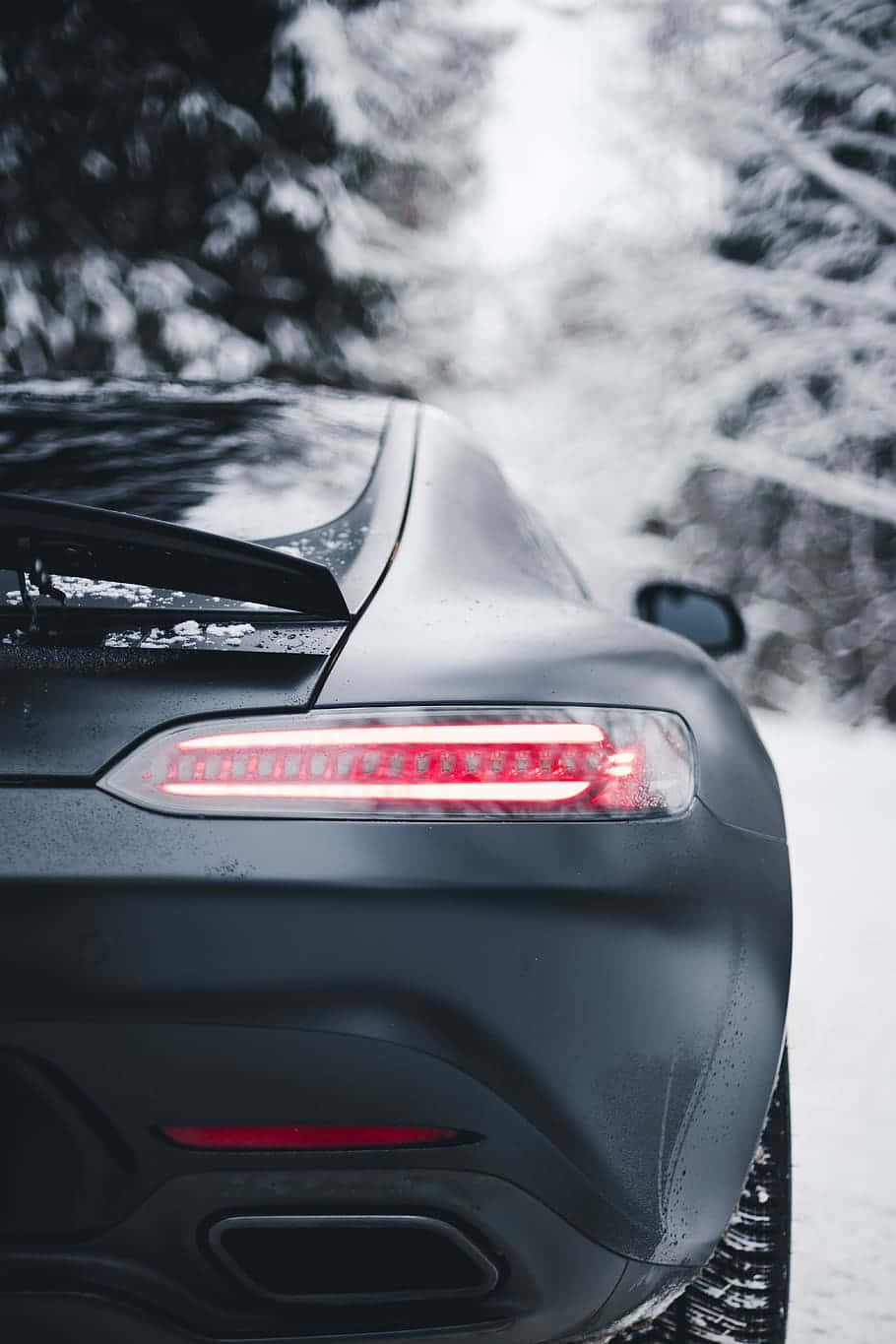Matte Black Car Winter Drive Wallpaper