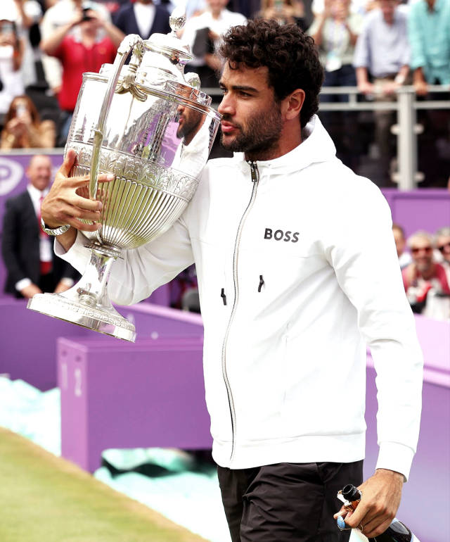 Matteo Berrettini Proudly Holding His Tennis Trophy Wallpaper