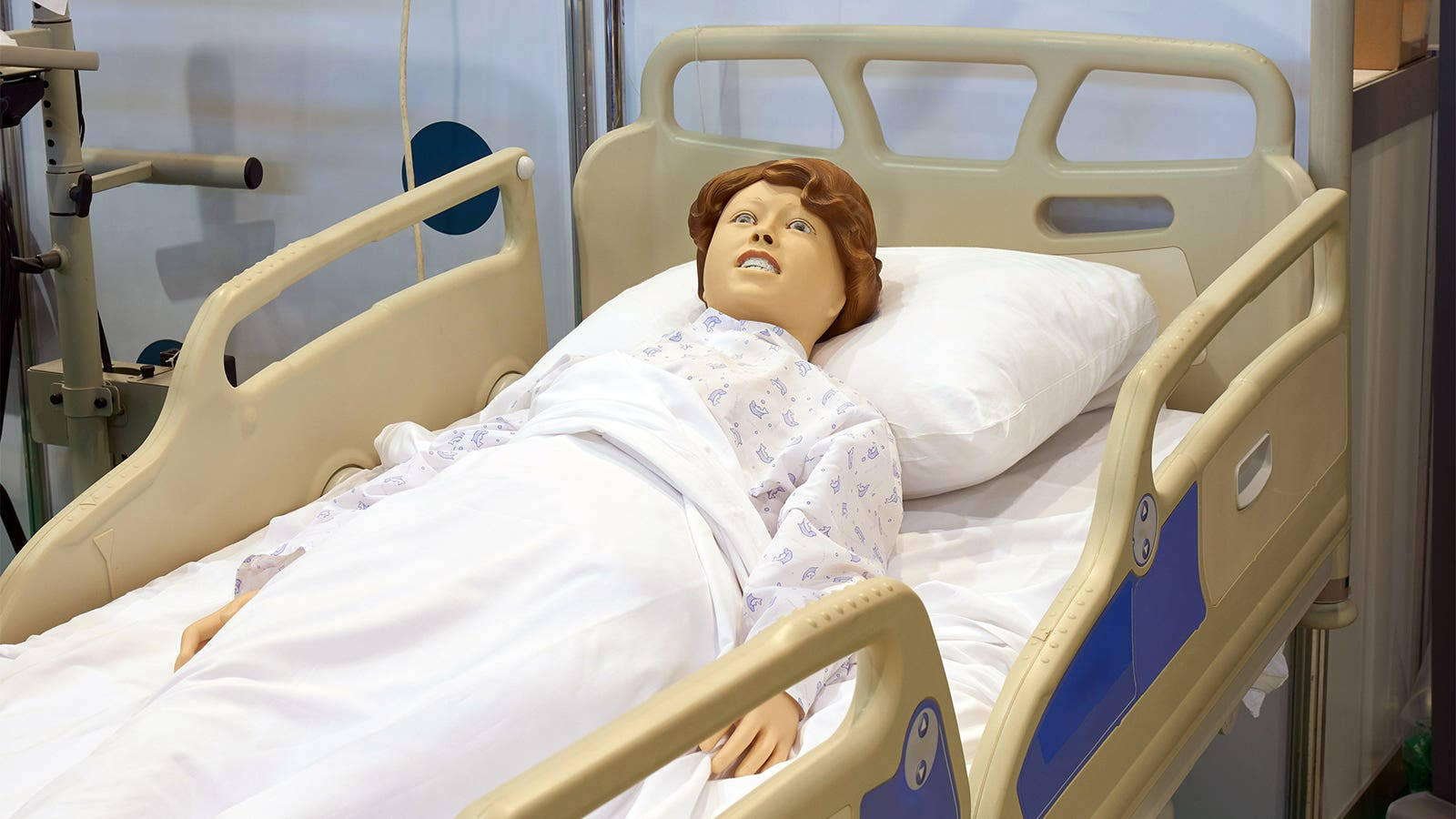 Mature Man Lying On Hospital Bed Wallpaper