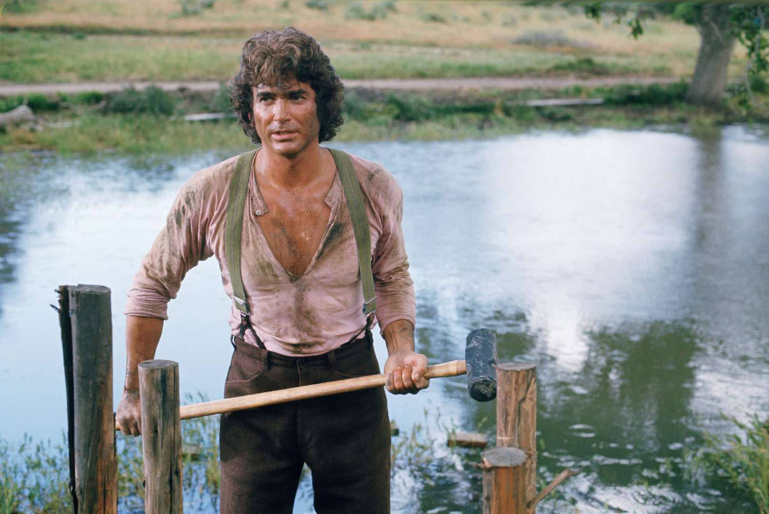 Michael Landon As Charles Ingalls Portraying Intensity And Resilience Wallpaper