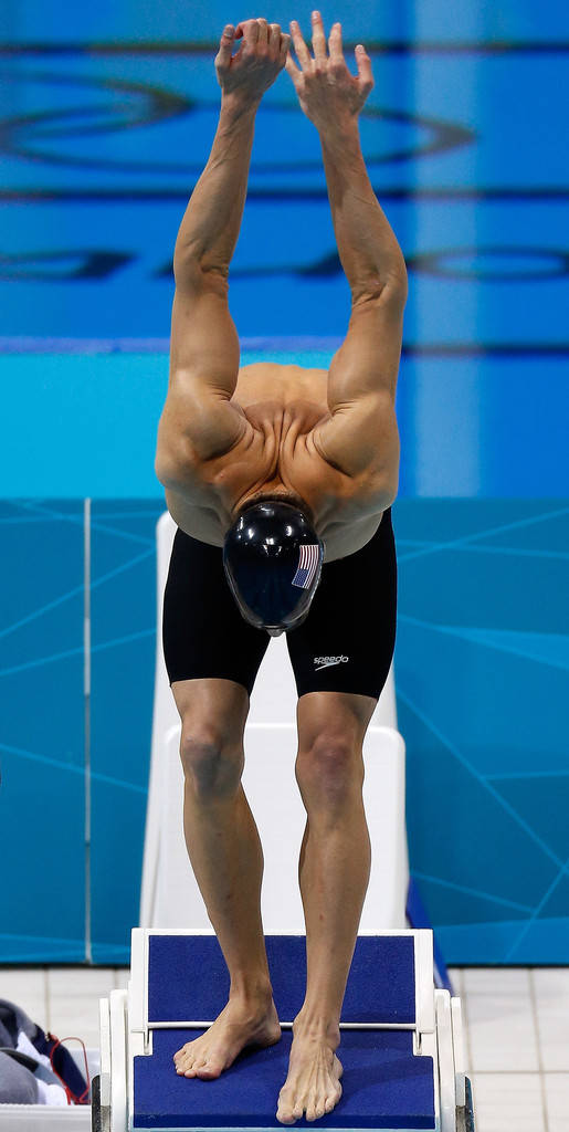 Michael Phelps In Mid-dive Action Wallpaper