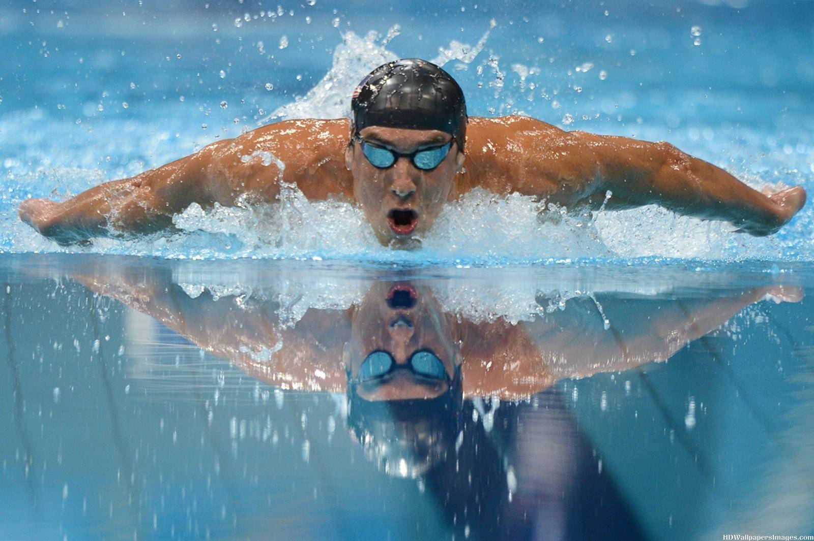 Michael Phelps, The Olympic Legend, Performing A Dive Wallpaper