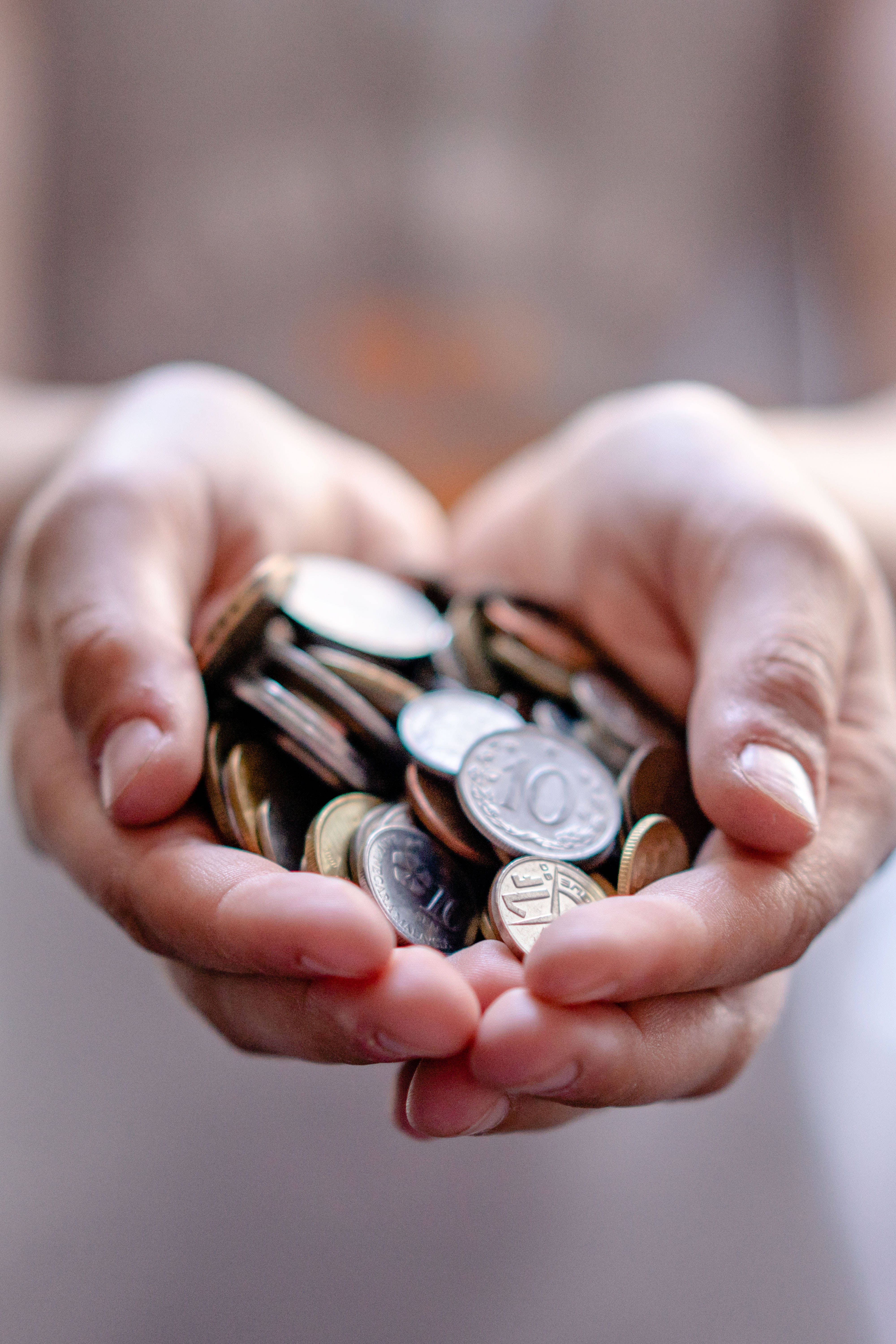 Money Background Hand Holding Pile Of Coins Wallpaper