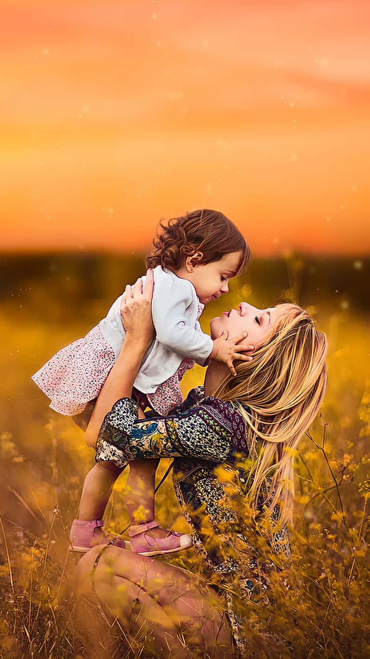 Mother Child Sunset Embrace Wallpaper