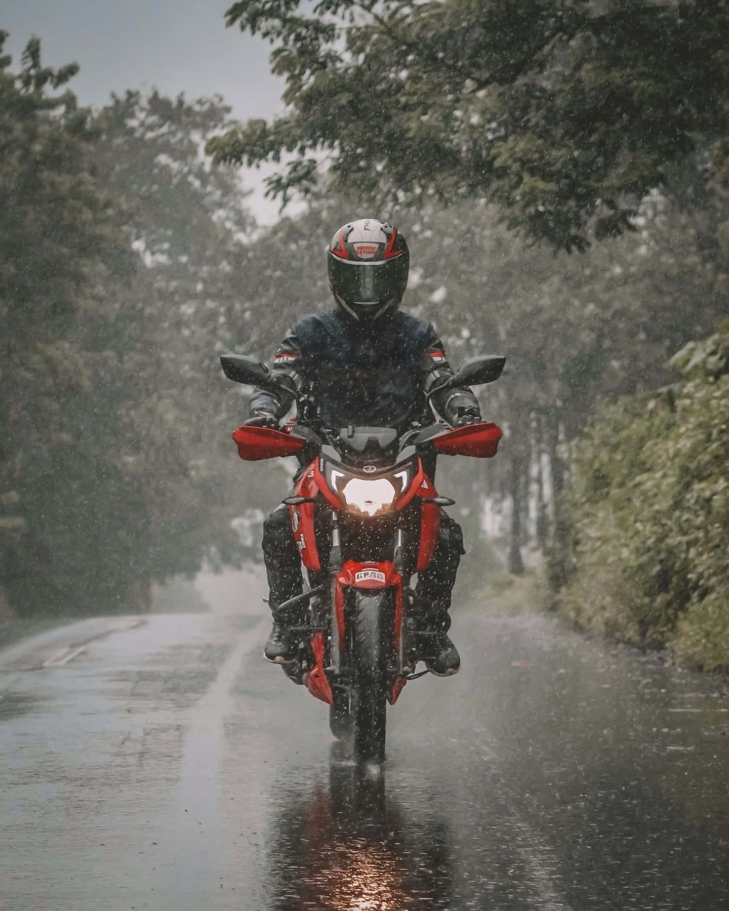 Motorcyclistin Rain Wallpaper