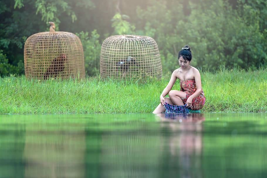 Myanmar Girl Washing Clothes In River Wallpaper