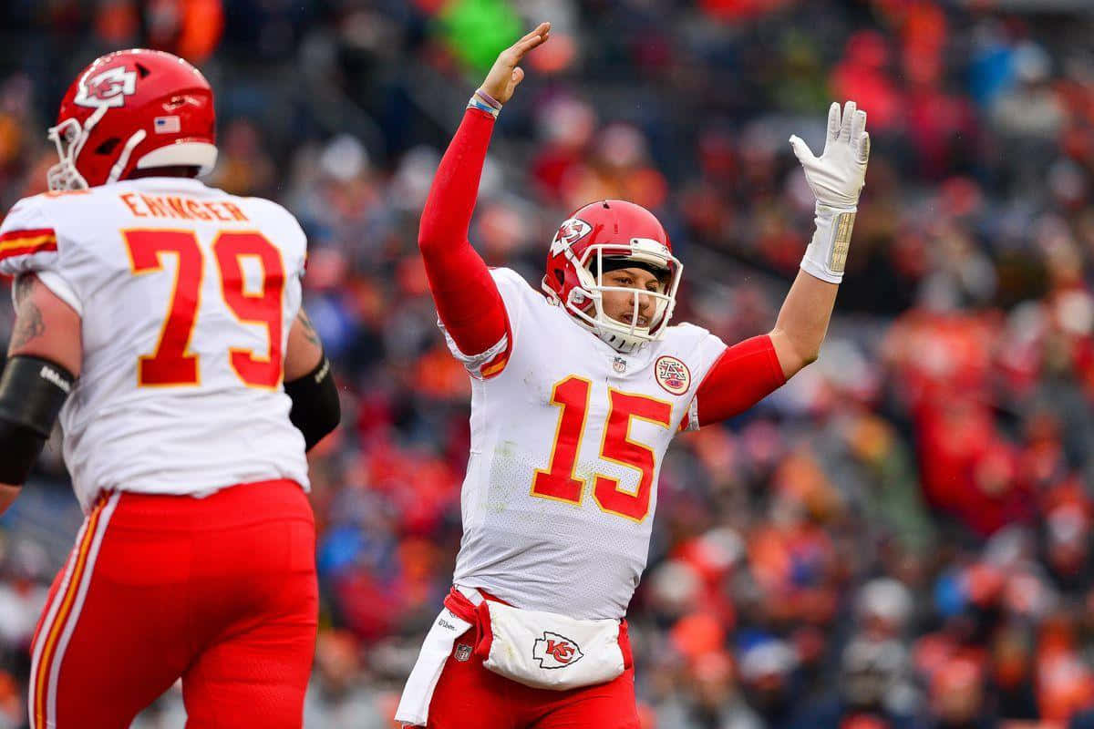 Nfl Mvp Pat Mahomes Embracing Technology Wallpaper