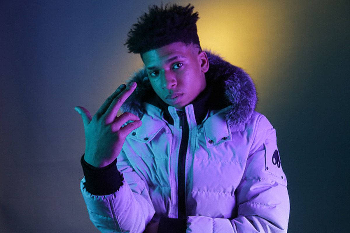 Nle Choppa In A Purple Aesthetic Look Wallpaper