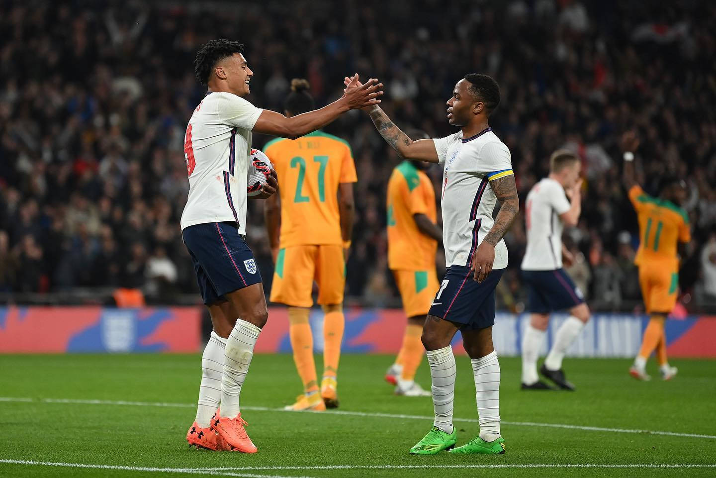 Ollie Watkins High Five With Teammate Wallpaper