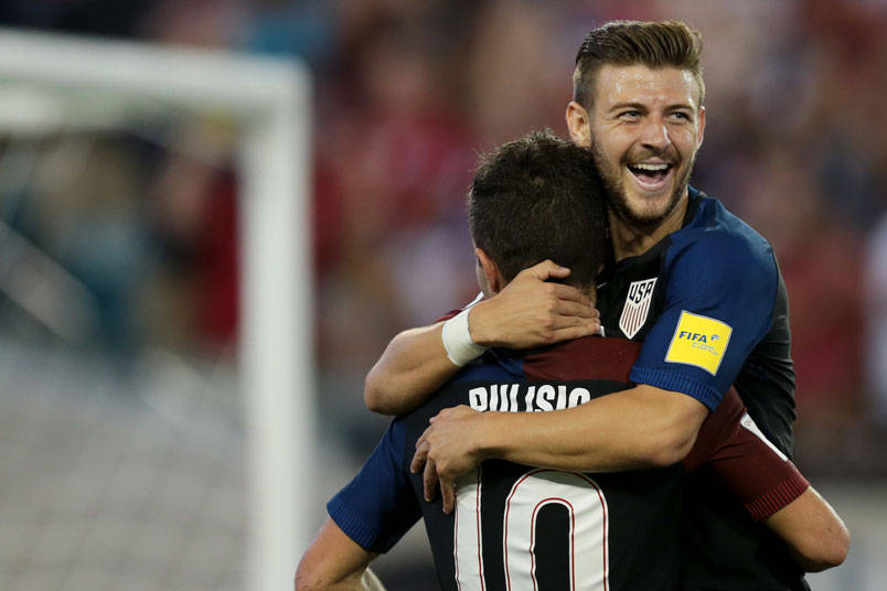 Paul Arriola Hugs Christian Pulisic Wallpaper