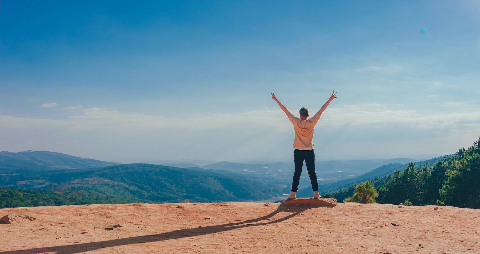 Person On Mountain Cliff Freedom Wallpaper